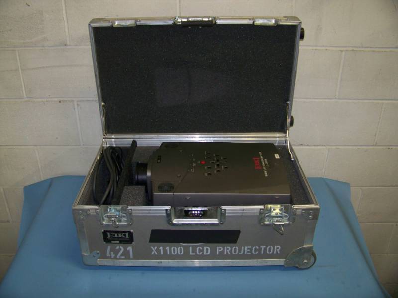 lot 73 image: EIKI, LC-X1100, LCD Projector with Remote Control in Hard Sided, Padded Inside Travel  Shipping Case with Telescoping Handle on Wheels