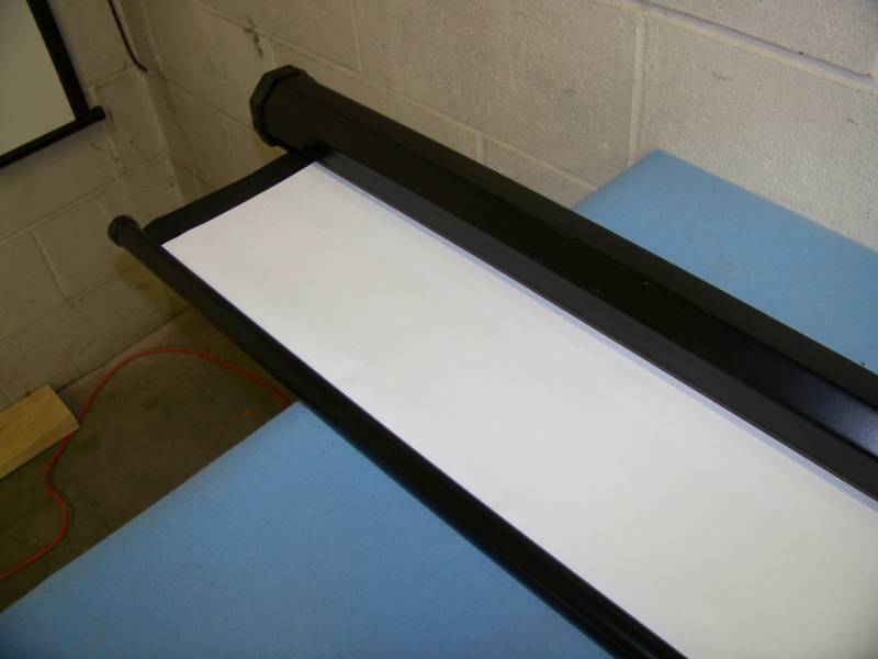 lot 28 image: Quartet, Ceiling or Wall Mountable, Manual Pull Movie  Projection Screen