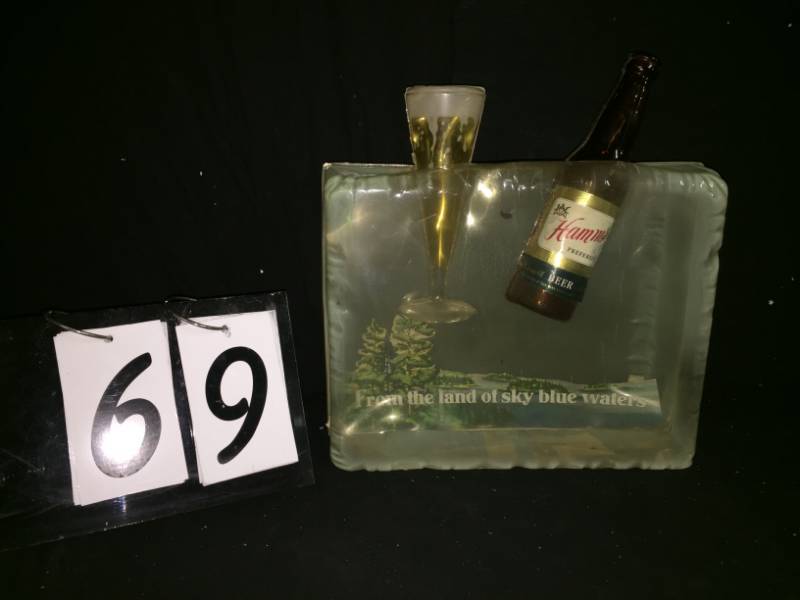 lot 69 image: Vintage Hamms bottle in an ice block