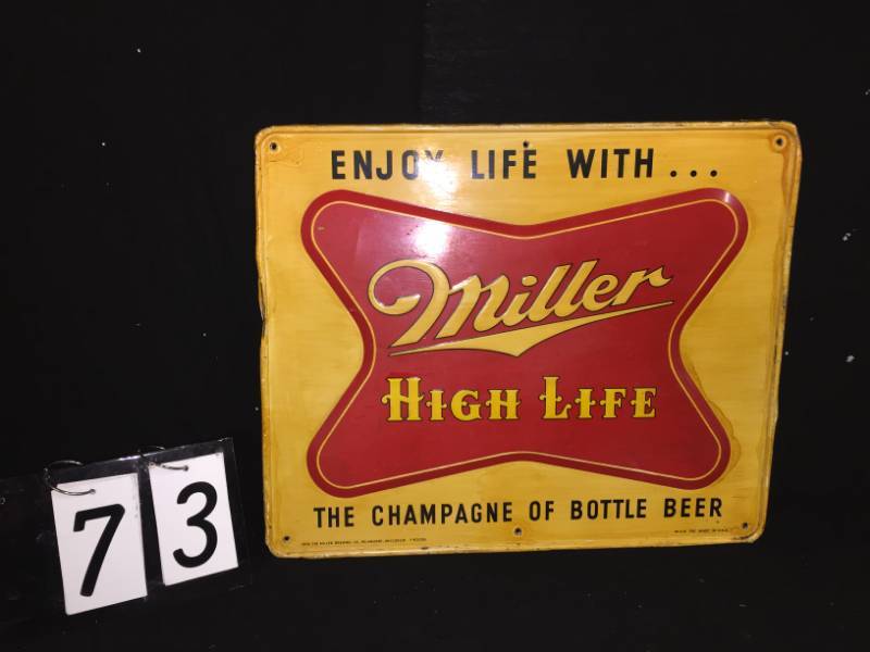 lot 73 image: 1954 Miller High Life tin tacker