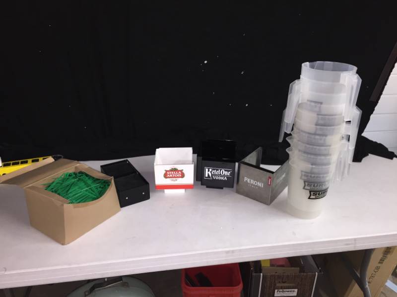 lot 245 image: Surly pitchers, Hell toothpicks, and Ketel One napkin holders