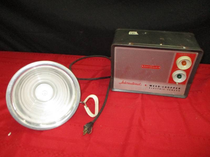 Electric fencer and heat lamp