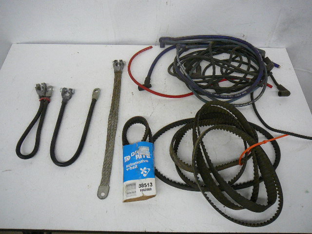 lot 64 image: Parts Battery Cables Plug wires Belts