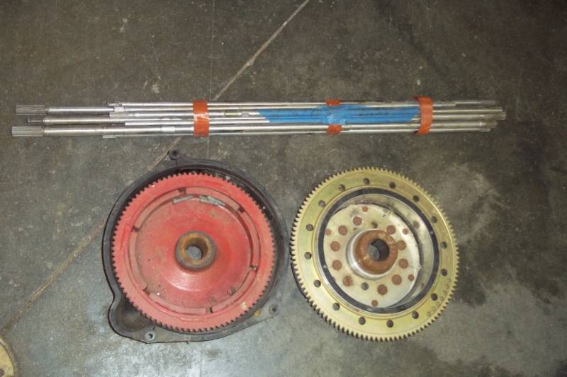 lot 14 image: Boat Motor Shafts and 2 Flywheels