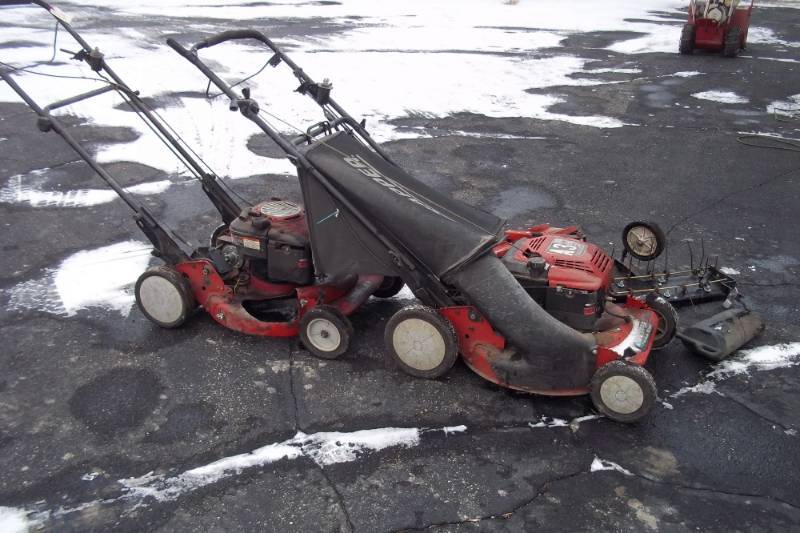 lot 44 image: Pair of Snapper Mowers, one need Drive system other needs motor.  Will make one good mower, includes Thatchers.