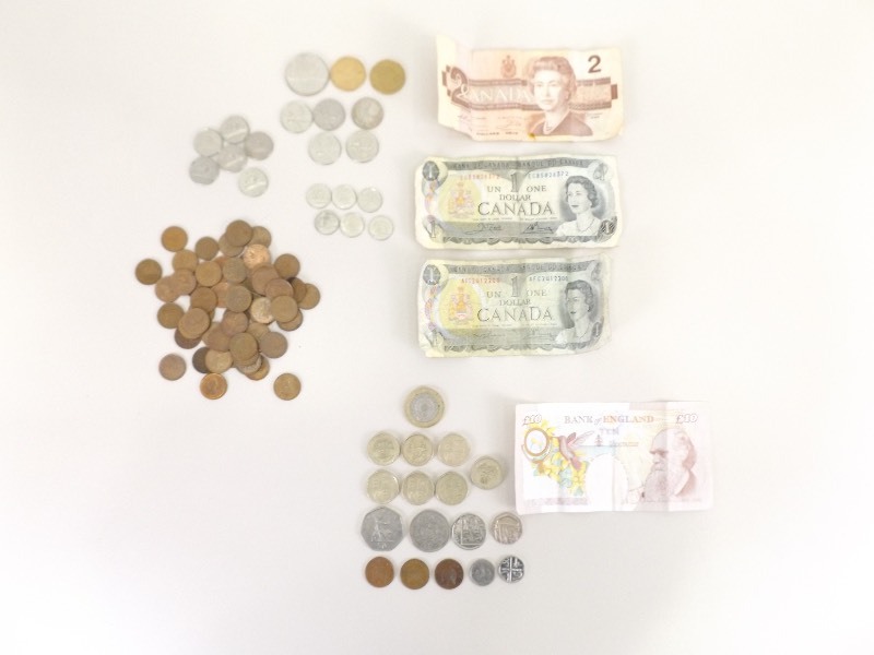 lot 69 image: $8 Canadian Dollars, and 20 British Sterling Pounds