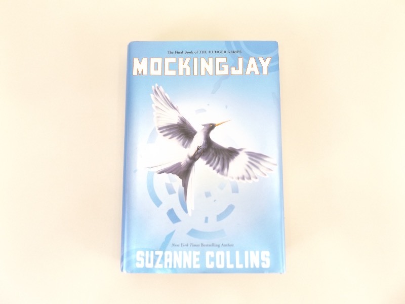 lot 91 image: First Edition Mocking Jay Hard Cover Book