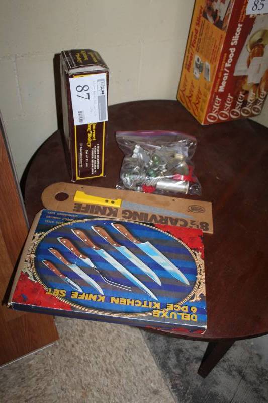 lot 87 image: 8-12 inch Carving Knive, Deluxe 6-Piece Kitchen Knife Set, Oldecolony Deluxe Gourmet 11-Piece Kitchen Toolery, Cookie Cutters