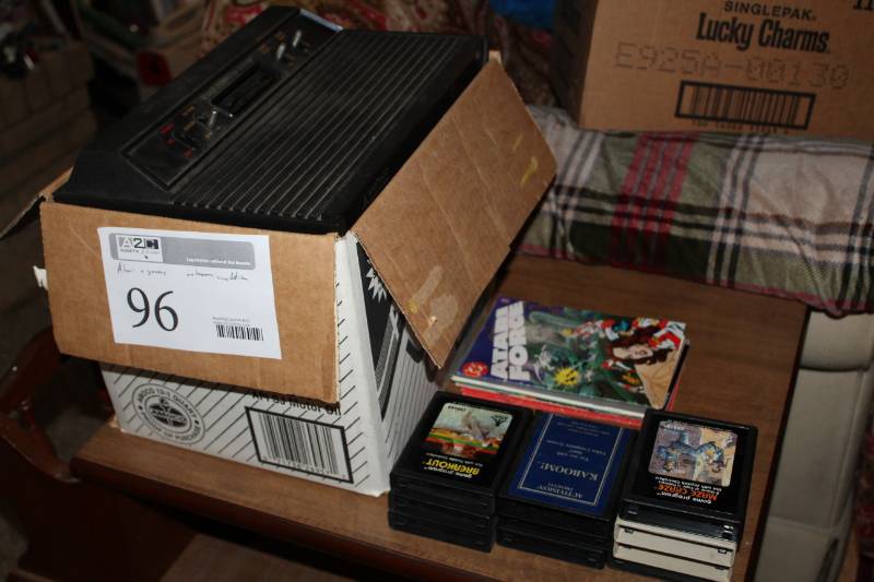 lot 96 image: Atari Game Console with Controllers, Game Cartridges
