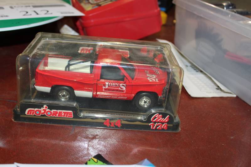 lot 204 image: Majorette Johns Towing 124 Scale Chevrolet Silverado 4x4 Toy Truck