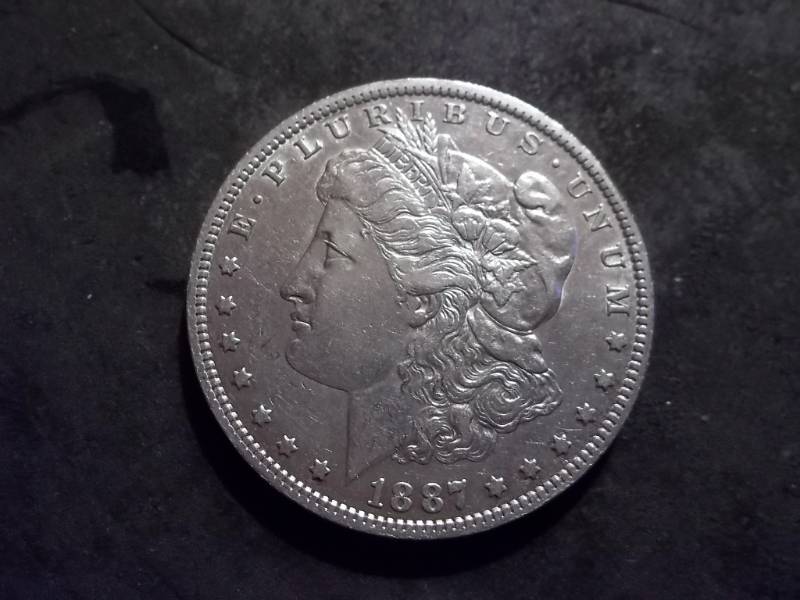 lot 8 image: 1887 O Morgan Silver Dollar