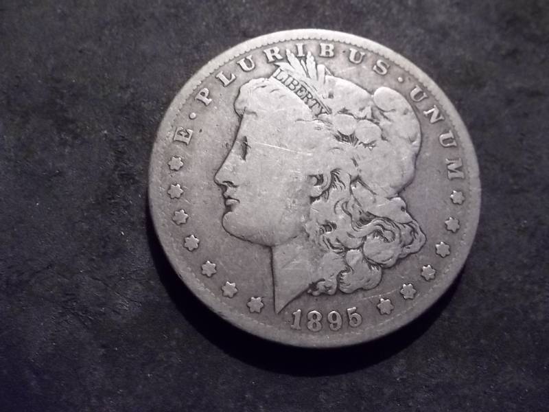lot 14 image: 1895 O Morgan Silver Dollar