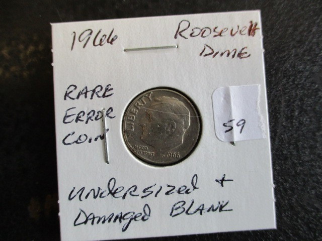 lot 59 image: 1966 Damaged Die & Undersized Blank Roosevelt Dime