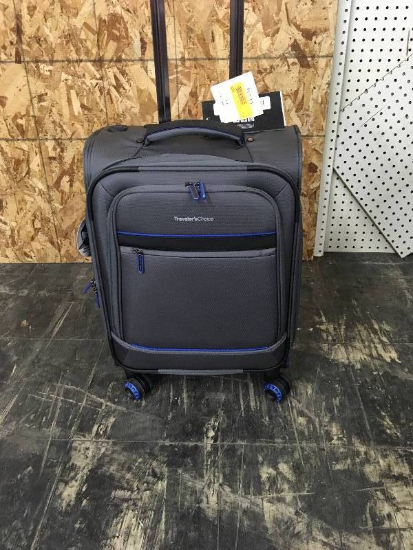 lot 99 image: Travelers Choice 22 Softside USB Port Luggage, Retail $59.99