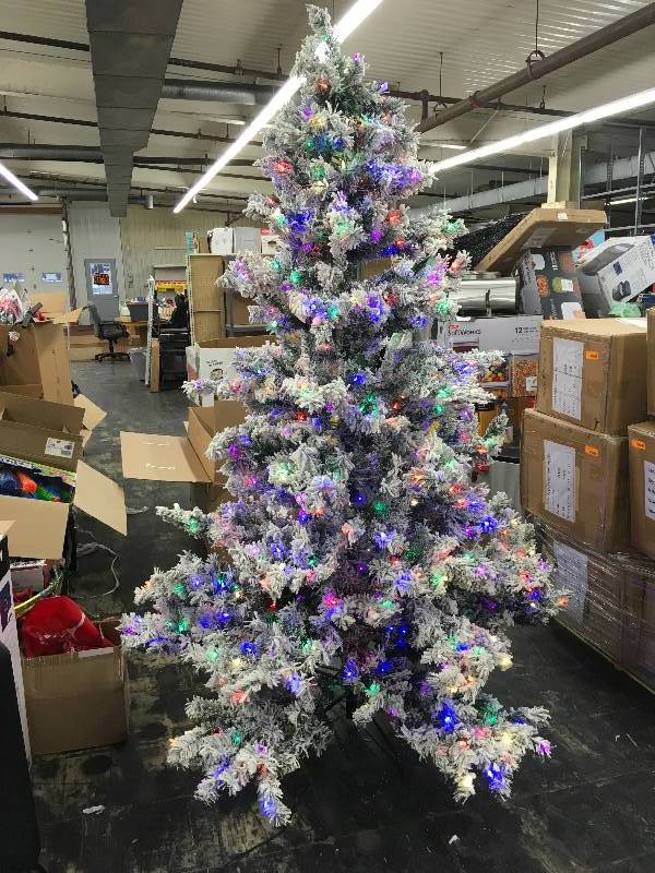 lot 1 image: Vickerman 9X63Frosted Balsam 1050 Multi-Colored Lighted Tree