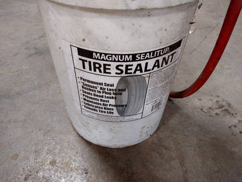 lot 482 image: Approx. (3) Gallons Tire Sealant wi...