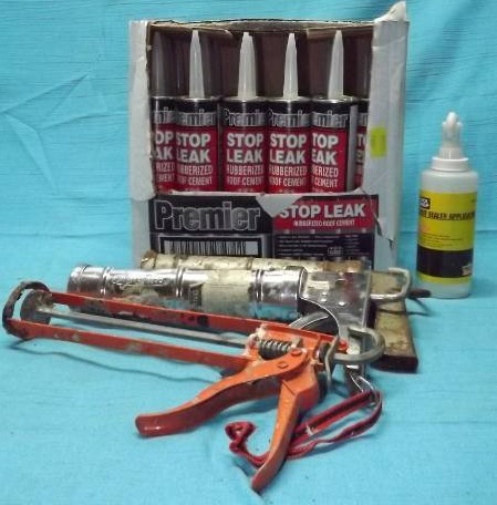 lot 212 image: Caulking Guns and Roof Cement