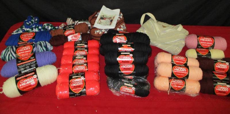 Various Rolls of Yarn.  Mostly New unopened.  Rubbermaid tote