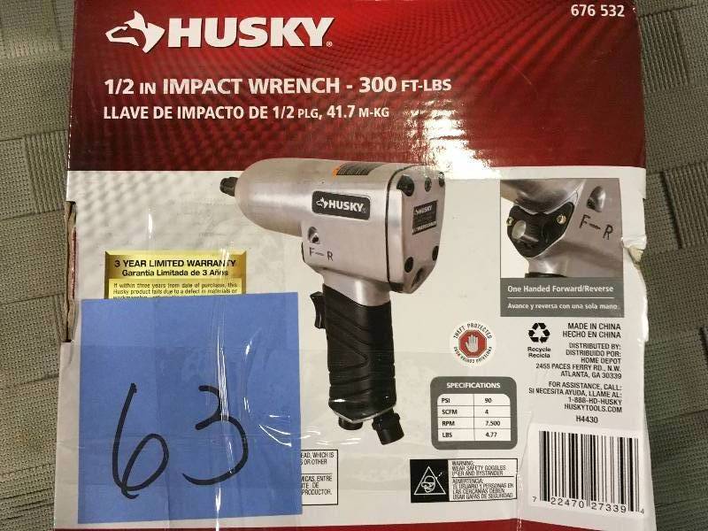 lot 63 image: Husky 12 in. 300 ft. lbs. Impact Wrench  in good working condition