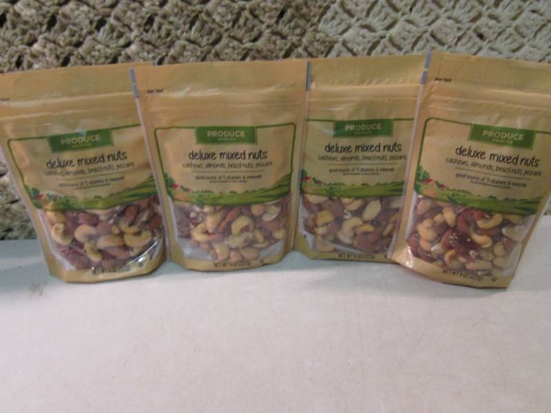 lot 188 image: 4 Bags of Deluxe Mixed Nuts Best by...