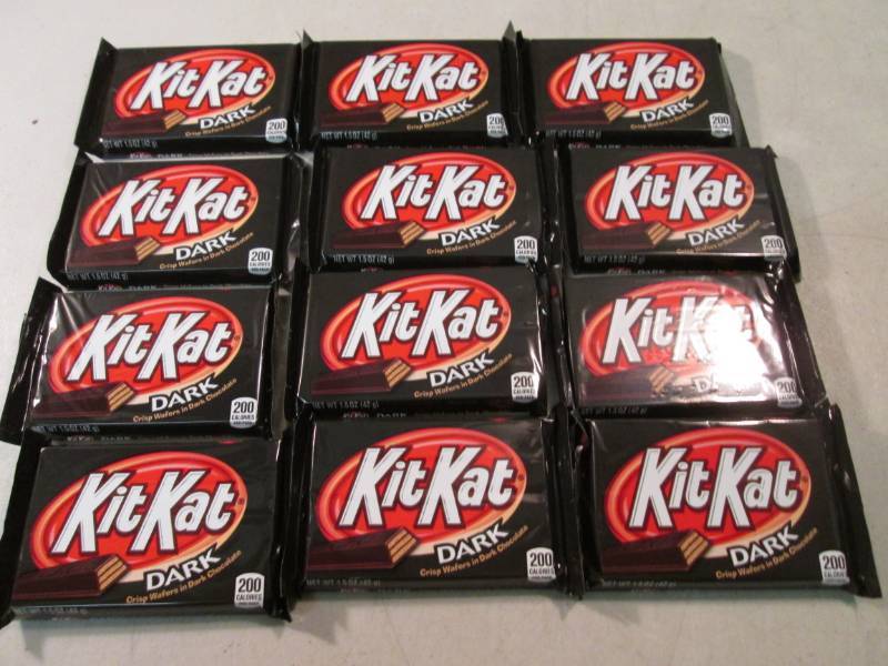 lot 201 image: 12 Kit Kat Dark Chocolate Candy Bar...