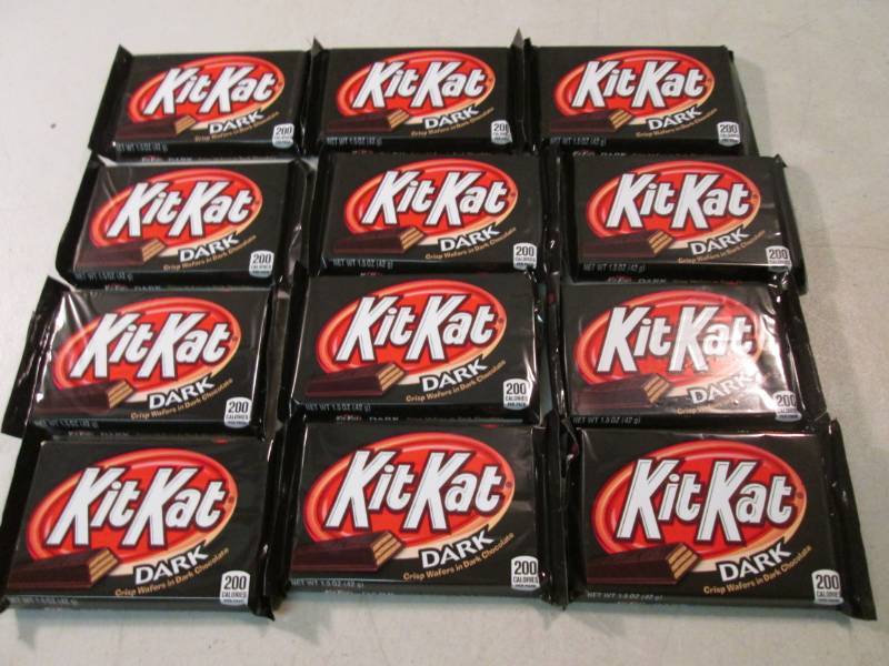 lot 202 image: 12 Kit Kat Dark Chocolate Candy Bar...