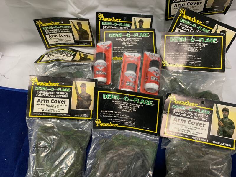 lot 54 image: Lot of 10 Camo Arm Covers & 3 Deer Dust Attractant