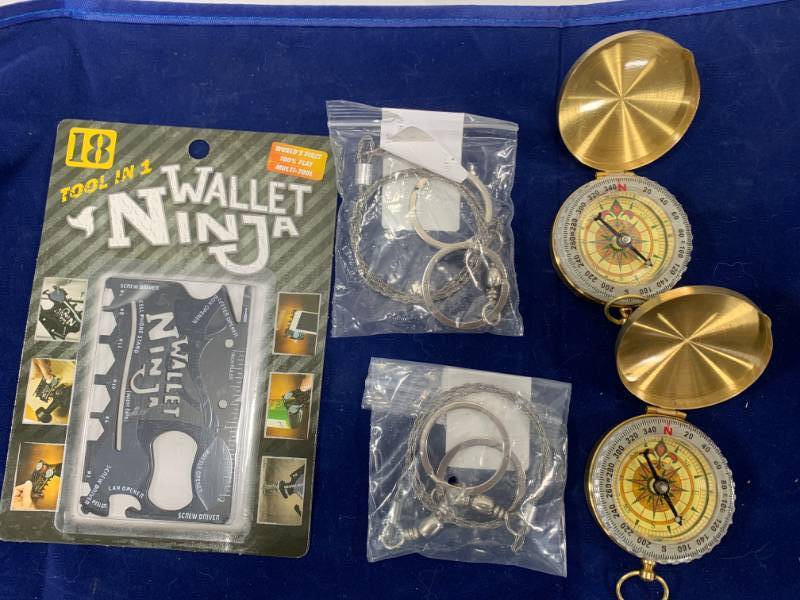 lot 77 image: Ninja Wallet, 2 Manual Chainsaws, 2 Illuminated Compasses