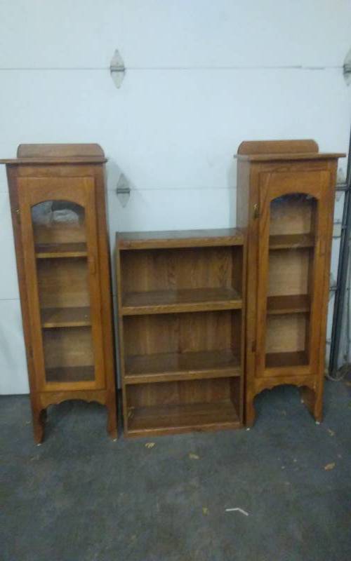 lot 6 image: 2-Oak Curio Type Cabinets 18x12x60, 1-Book Shelf 24x10x42