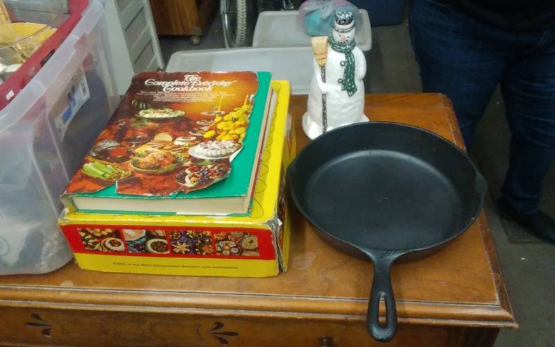 lot 41 image: Cast Iron Skillet, Case Iron Snowman Door Stop, Cook Books