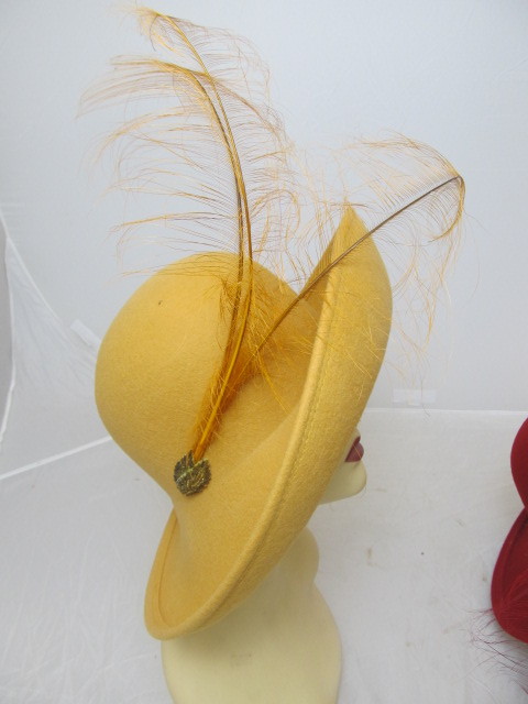 lot 14 image: BRAND NEW Pair of SEASONS Hats w Feather Accents - Red & Gold
