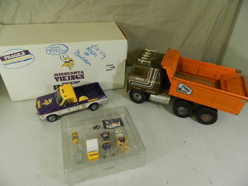 lot 61 image: Vintage ERTL Dump Truck and Minnesota Vikings Diecast