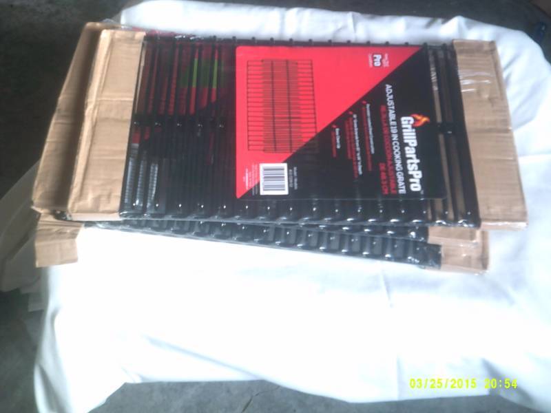 lot 34 image: GRILL PRO ADJUSTABLE 19 INCH COOKING GRATES
