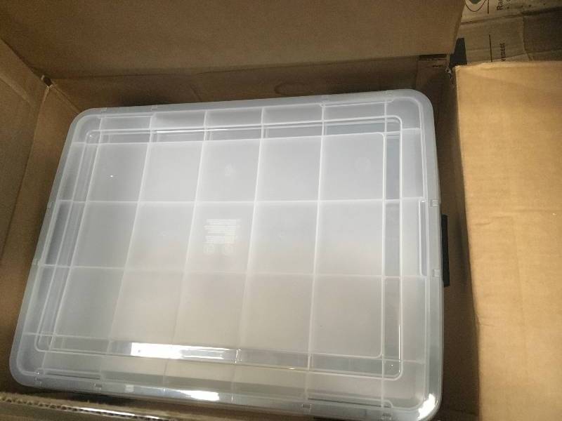 lot 54 image: IRIS 74 Qt. Weather Tight Storage Box in Clear not used
