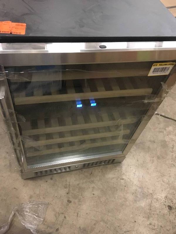 lot 72 image: AKDY 23.5 in. 46-Bottle Wine and 92-Can Built-in Compressor Beverage Cooler in very good condition small dents