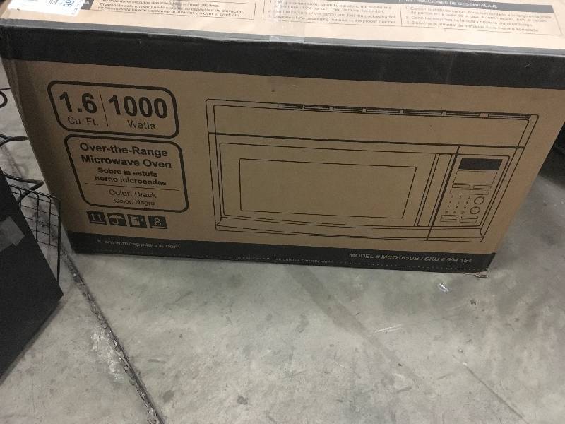 lot 73 image: Magic Chef 1.6 cu. ft. Over the Range Microwave in Black in like new condition