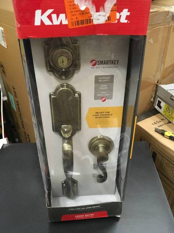 lot 83 image: Kwikset Arlington Antique Brass Single Cylinder Door Handleset with Lido Lever Featuring SmartKey Security in like new condition