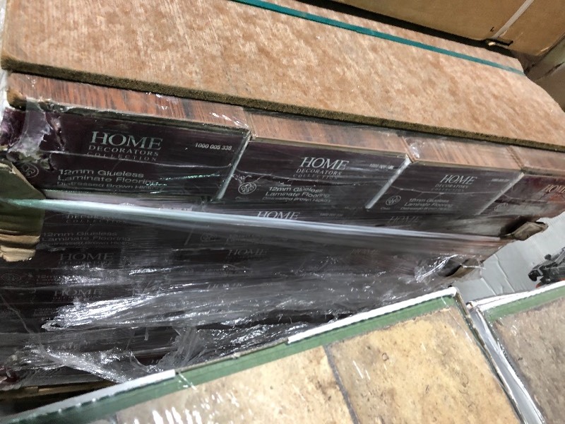 lot 109 image: Home Decorators Collection Distressed Brown Hickory 12 mm Thick x 6-14 in. Wide x 50-2532 in. Length Laminate Flooring (15.45 sq. ft.  case) 26 cases