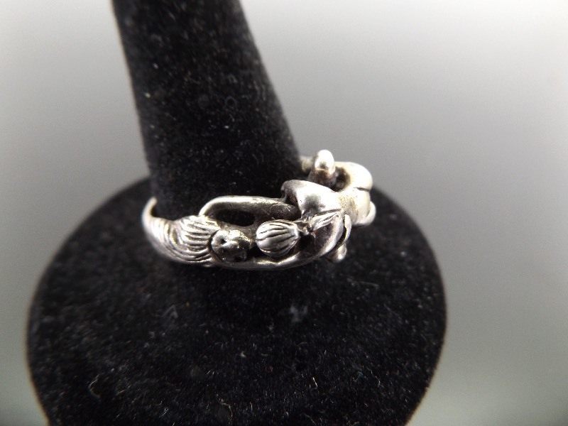 lot 13 image: .925 Sterling Silver LGBT Woman Embrace Ring Sz 8.5