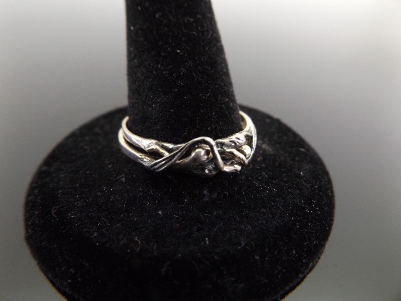 lot 14 image: .925 Sterling Silver LGBT Woman Embrace Sz 10 Puzzle Ring