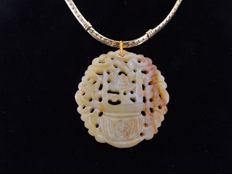 lot 55 image: Large Carved Stone Pendant on Gold Trifari Necklace