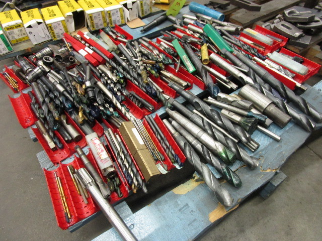 A PALLET OF DRILL BITS AND COLLETS