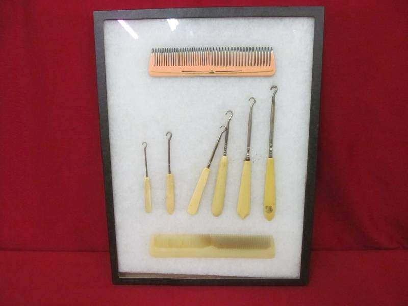 lot 130 image: vintage Bakelite hair care set