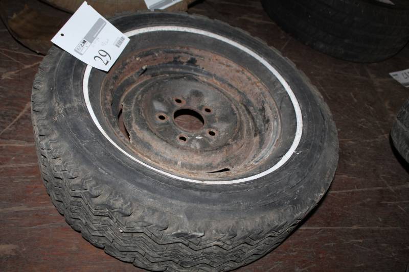 lot 29 image: G70-14 Whitewall Tire with 4.75in. Bolt 5-Lug 14in. Steel Wheel