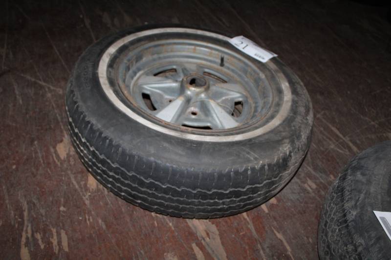 lot 21 image: P20575R15 Whitewall Tire with Pontiac 5in. Bolt 5-Lug 15in. Wheel