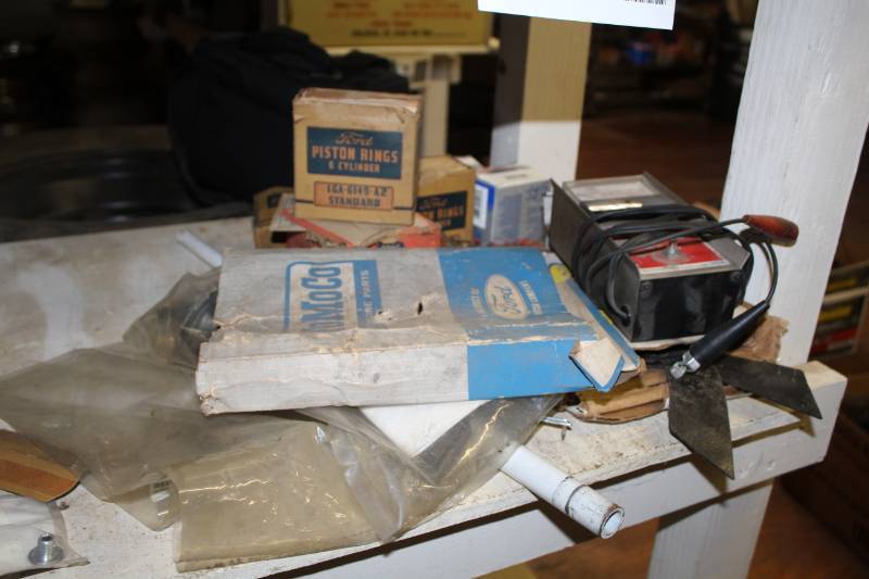 lot 115 image: Piston Rings, Fuel Sending Unit, Jack Handle, Mustang Taillight Lens, Thermostat, Condensors