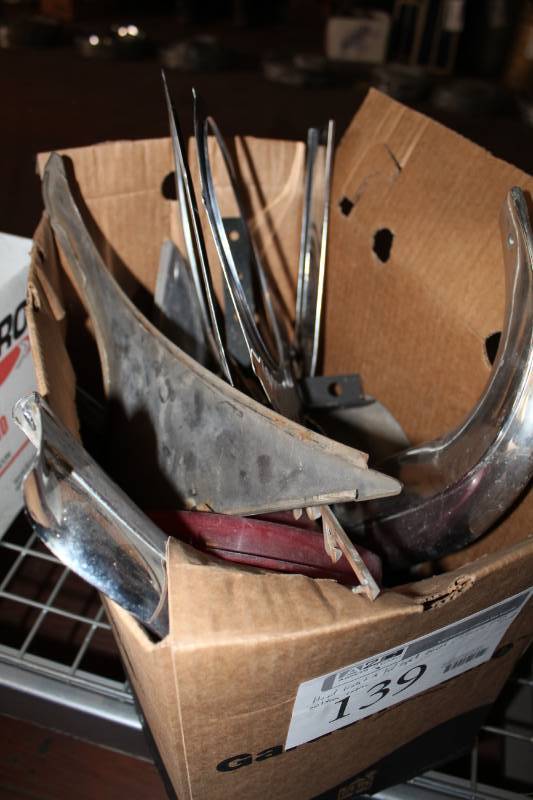 lot 139 image: Headlight and Taillight Bezels, License Plate Mount, Emblems, And More