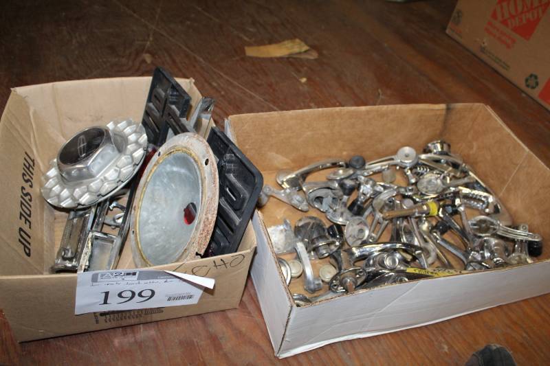 lot 199 image: Door Handles, Window Cranks, Trunk Emblems, Dome Lights, Center Caps