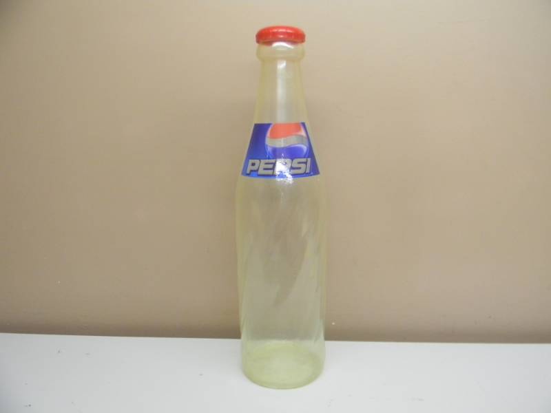 lot 12 image: VINTAGE PEPSI COIN BANK ADVERTISING BOTTLE - APPROX 25 - SEE PICTURES