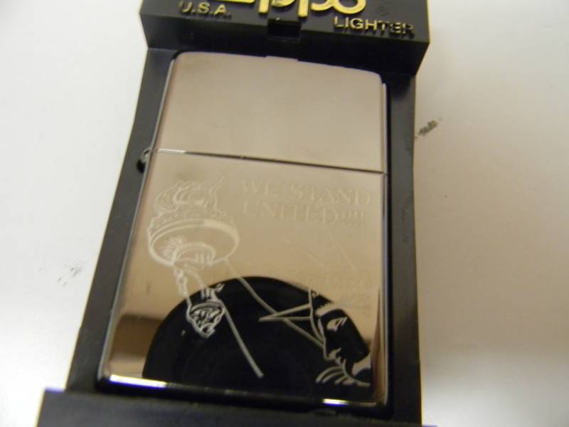 lot 51 image: NOS STILL IN THE BOX WE STAND UNITED ZIPPO LIGHTER - SEE PICTURES